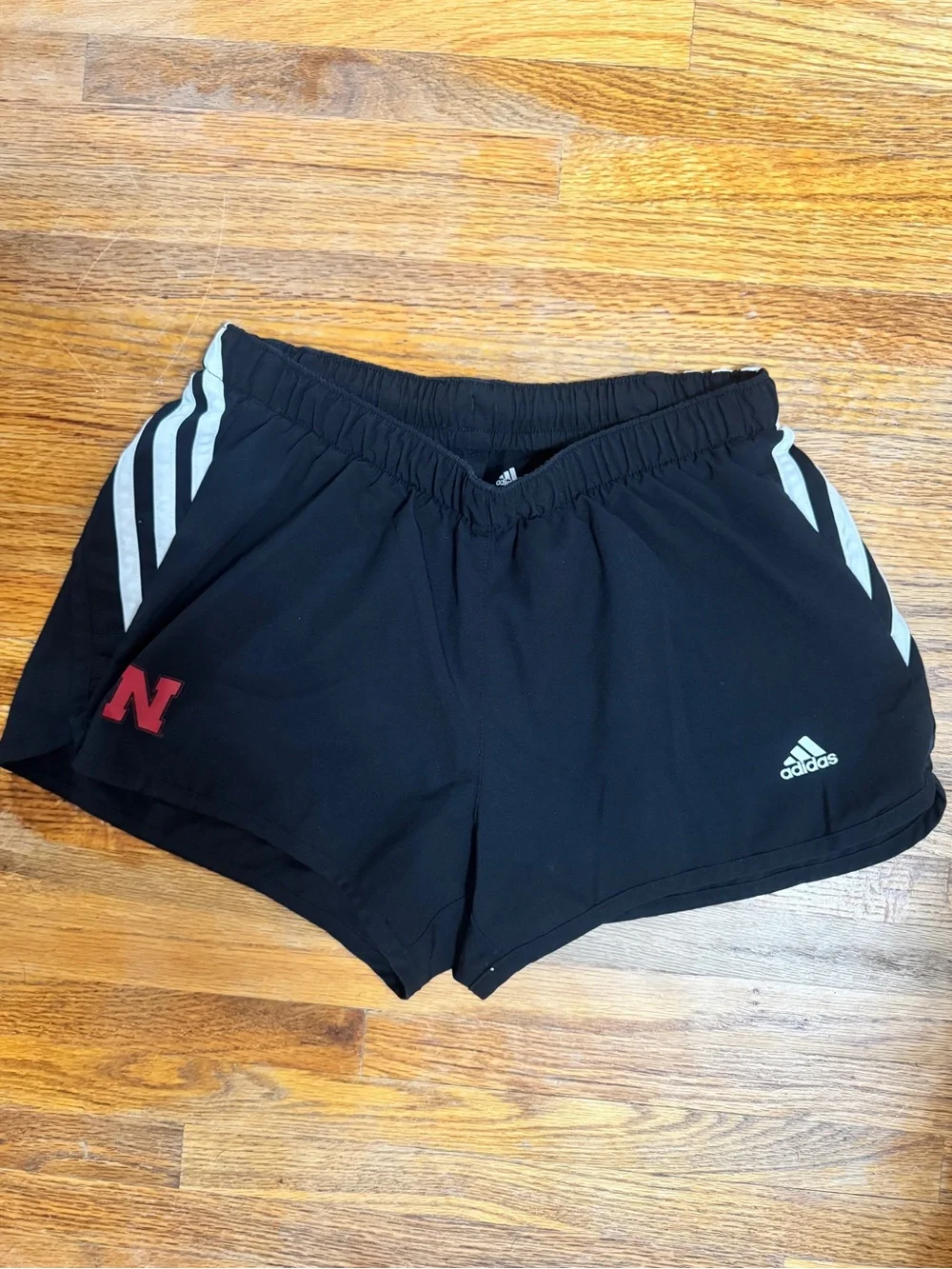 adidas Black Athletic Shorts with White Stripes and Husker Red Accent Logo